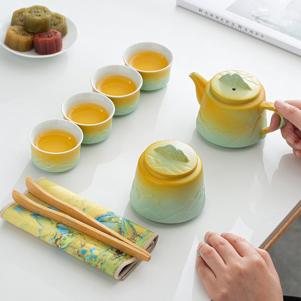 Tea set in use, pouring tea from the traditional teapot into cups