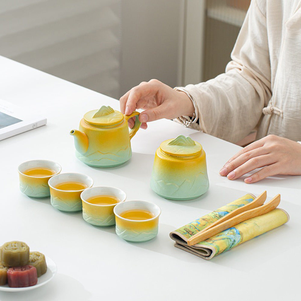 Beautifully arranged ceramic tea set with accessories on a wooden tray