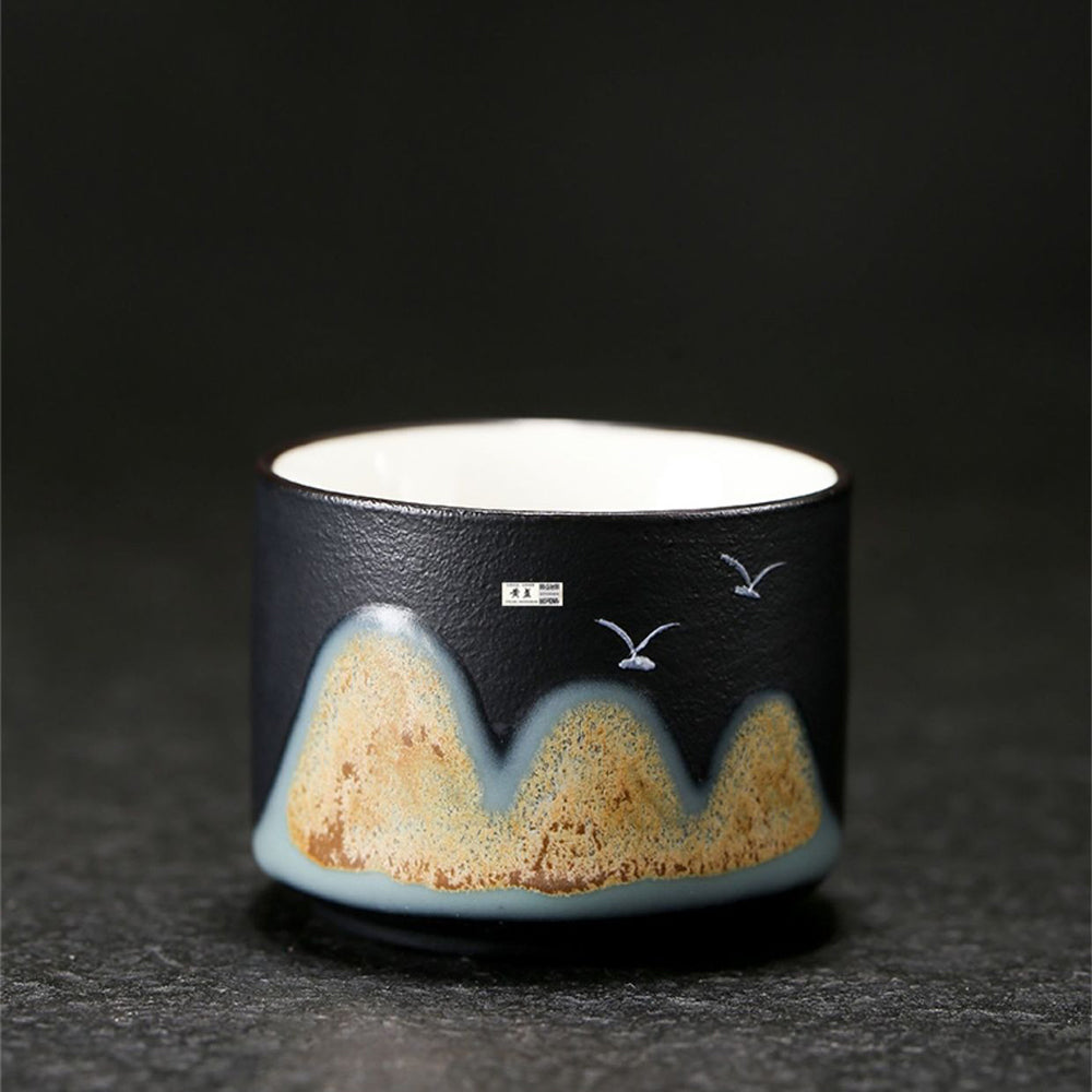 Full view of the Mountains and Birds Ceramic Tea Set, highlighting the semi-matte black finish