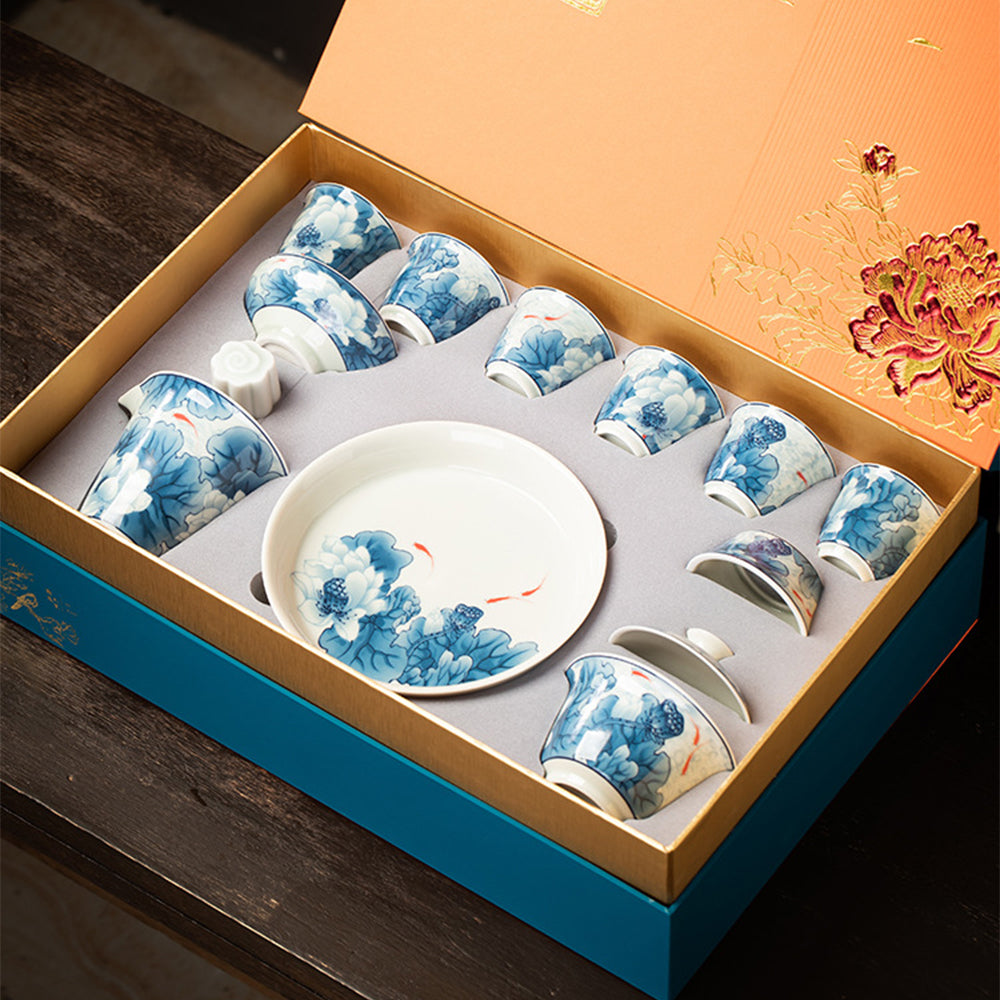 Elegant Silver-Plated Lotus Porcelain Tea Set displayed on a wooden table, highlighting its intricate lotus patterns.