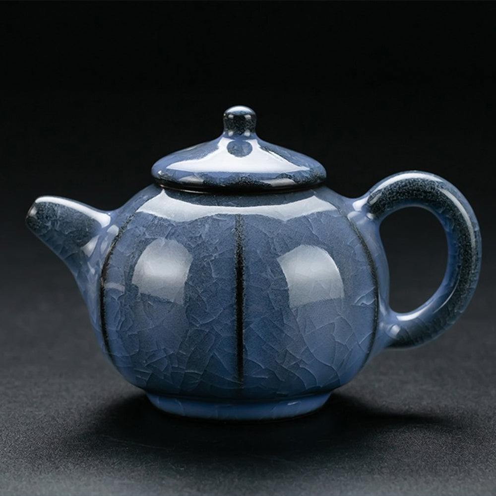 Complete blue ceramic tea set with tea pet, showcasing all included items.