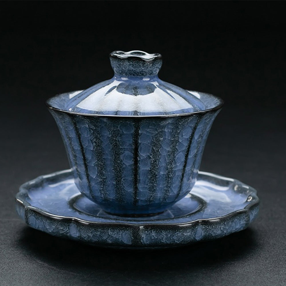 Blue ice crack kung fu tea set displayed elegantly with tea cups and teapot.