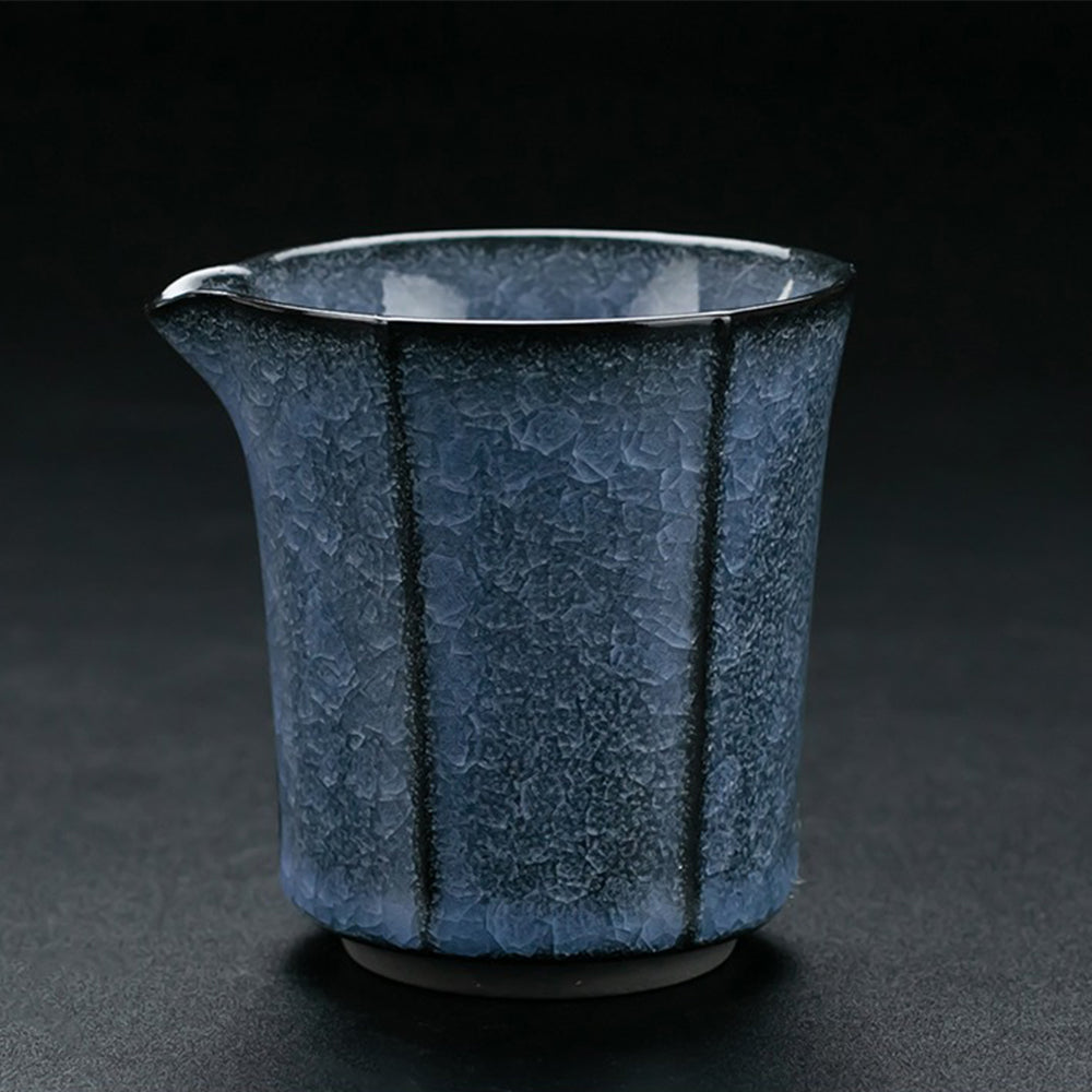Complete blue ceramic tea set with tea pet, showcasing all included items.
