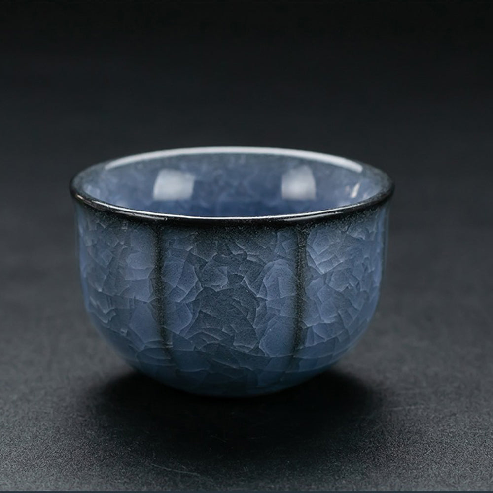 Blue ice crack kung fu tea set displayed elegantly with tea cups and teapot.