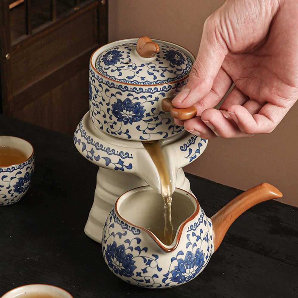 Side angle of the fair cup and tea cups, emphasizing the symmetry and craftsmanship of the porcelain tea set.
