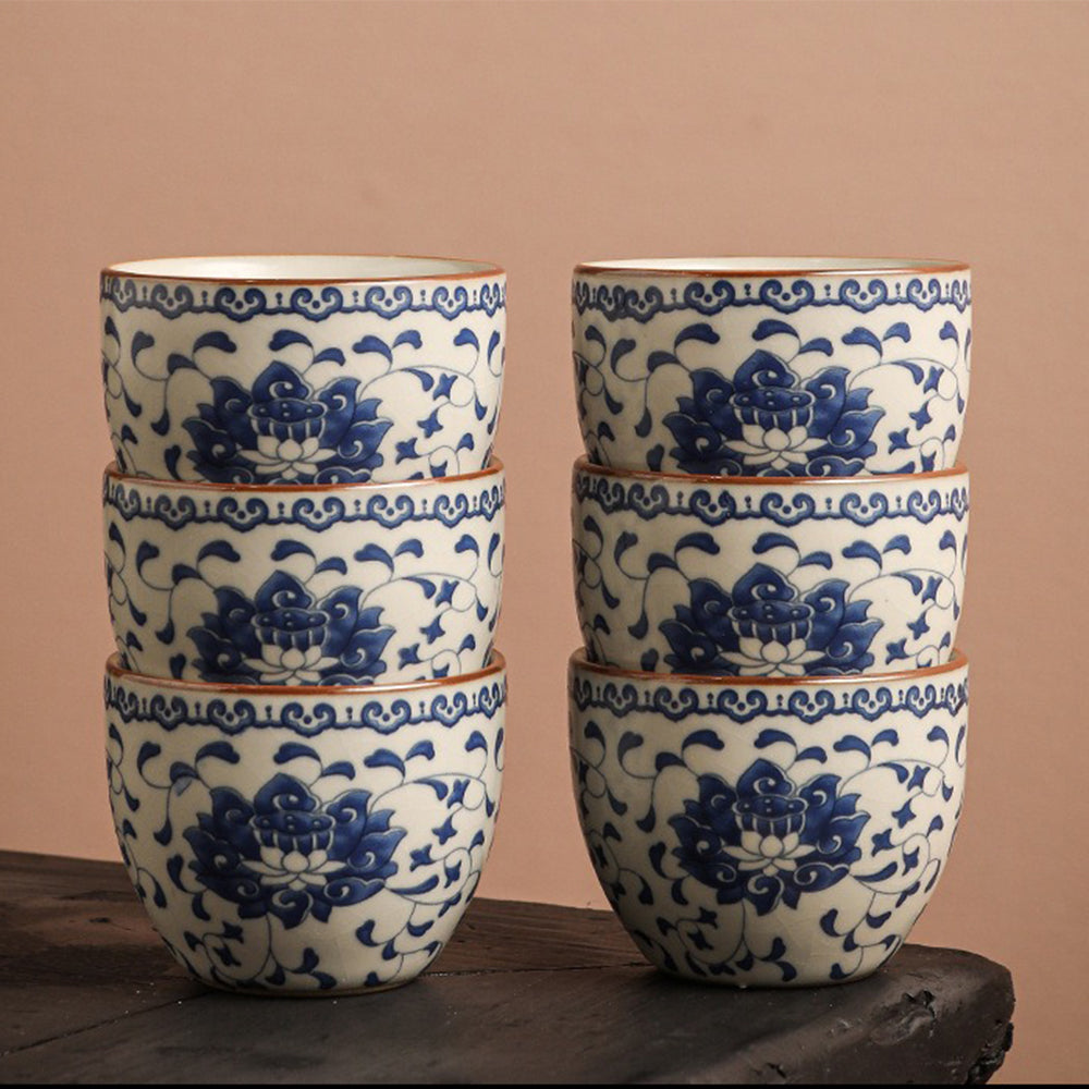 Top view of the blue and white porcelain tea set arranged for serving, showcasing lotus patterns and crackle glaze.
