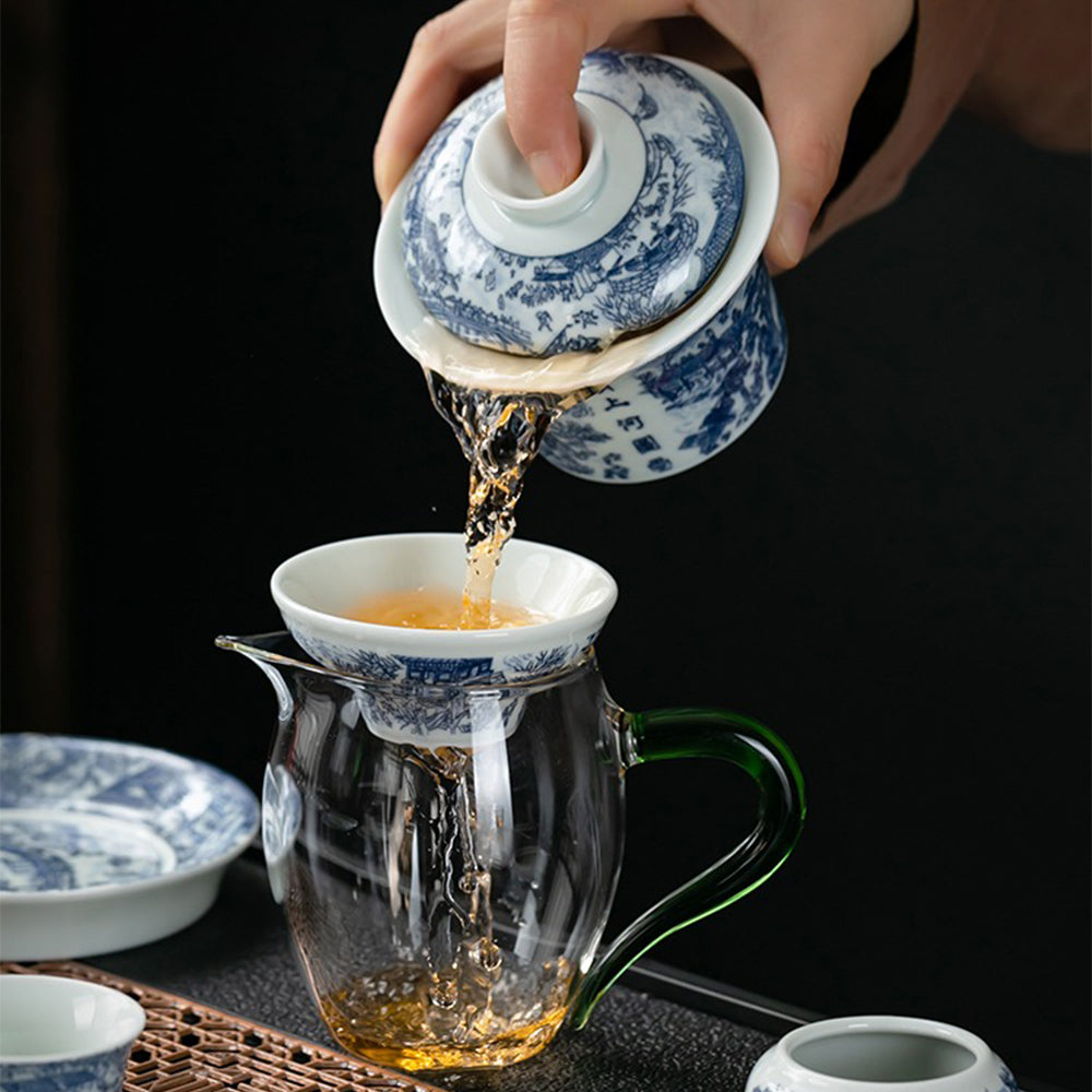 Complete Chinese tea set with gaiwan, cups, and strainer, arranged on a tea table ready for a traditional tea ceremony