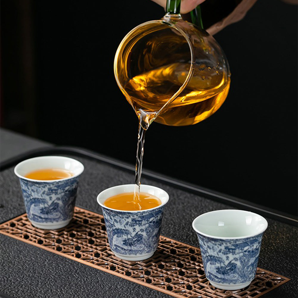 Vintage Chinese porcelain tea set featuring Qingming River Scene, with gaiwan and cups, ideal for tea ceremony and gift-giving
