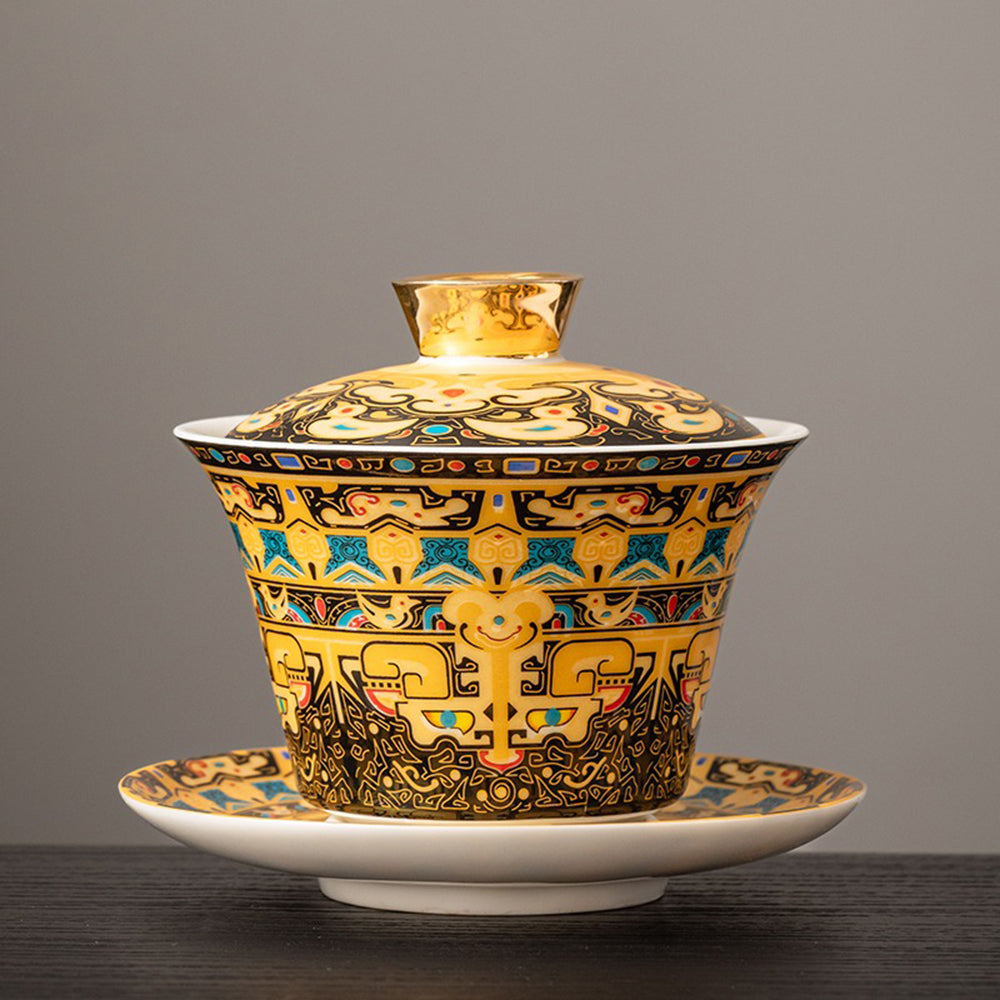 Close-up of Thangka enamel porcelain gaiwan with Tibetan pattern on surface