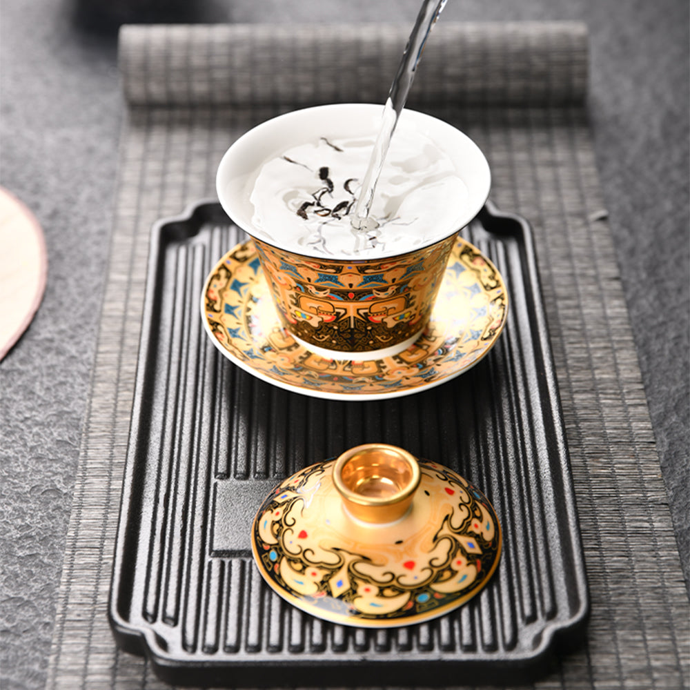 Close-up of Thangka enamel porcelain gaiwan with Tibetan pattern on surface