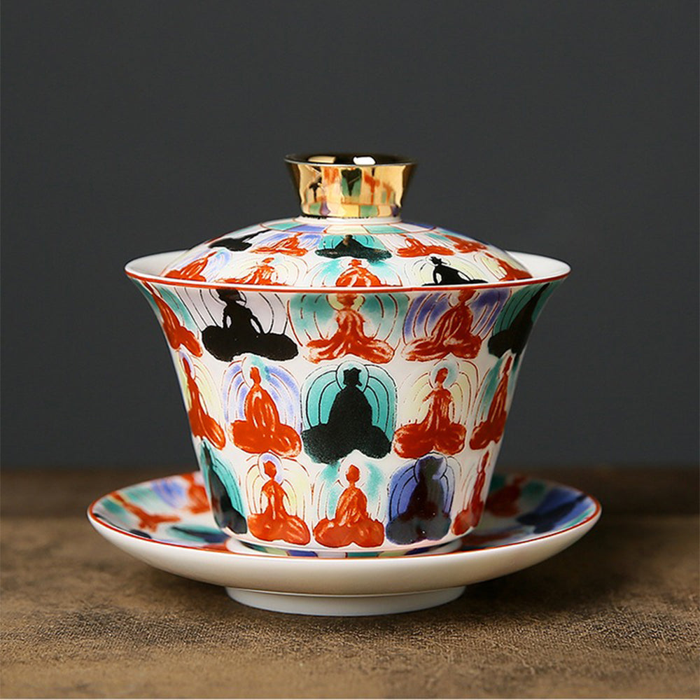 Elegant Buddha porcelain gaiwan set with intricate patterns, ideal for tea brewing.