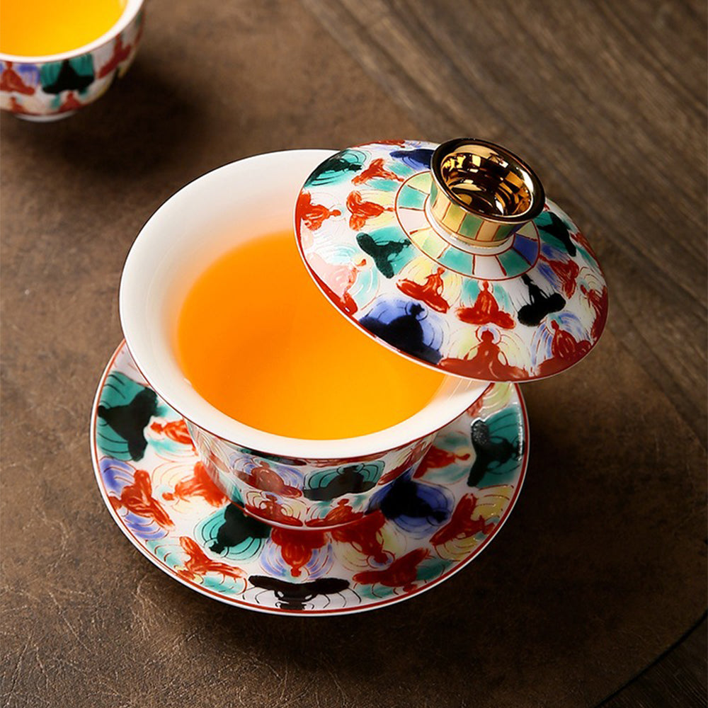 Full view of the porcelain tea set showcasing its lightweight design and beautiful Buddha motifs.