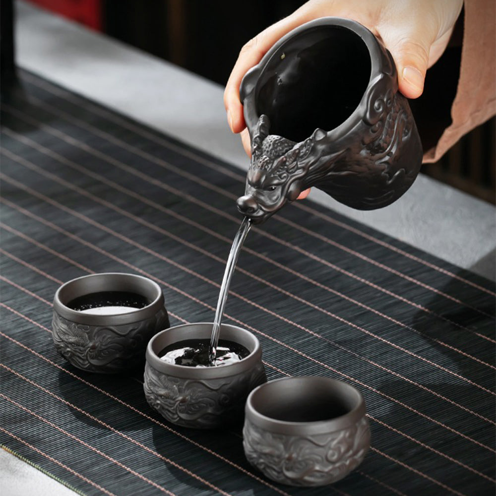 Gift box presentation of the traditional Chinese tea set for sale, with protective padding and branded packaging featuring gold accents.
