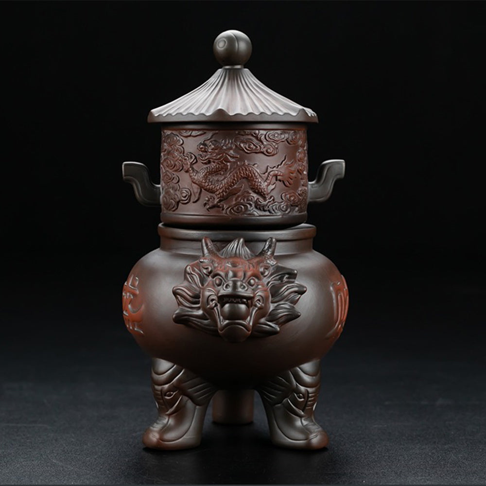 Close-up of the dragon teapot pouring tea smoothly into a fair cup, highlighting its automatic feature.