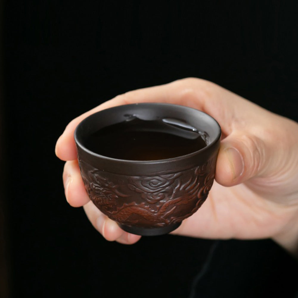 Complete view of the purple pottery tea set, emphasizing its elegant design and rich color.