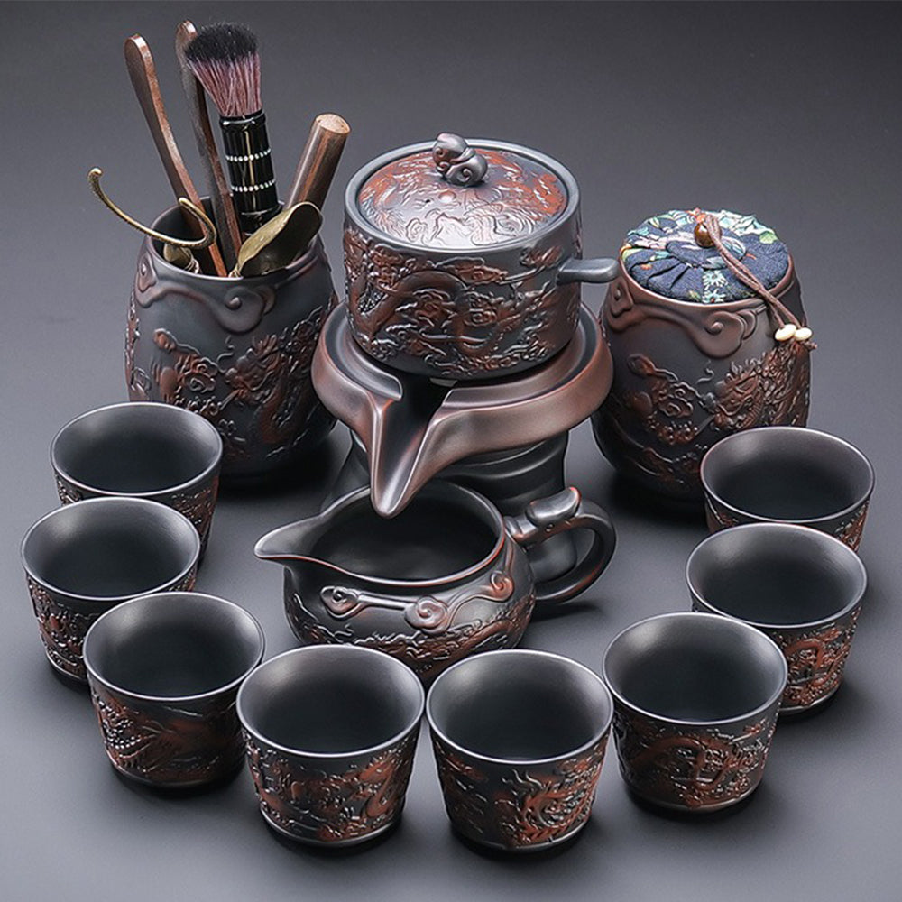 Close-up of handcrafted purple clay dragon and phoenix patterns on teapot