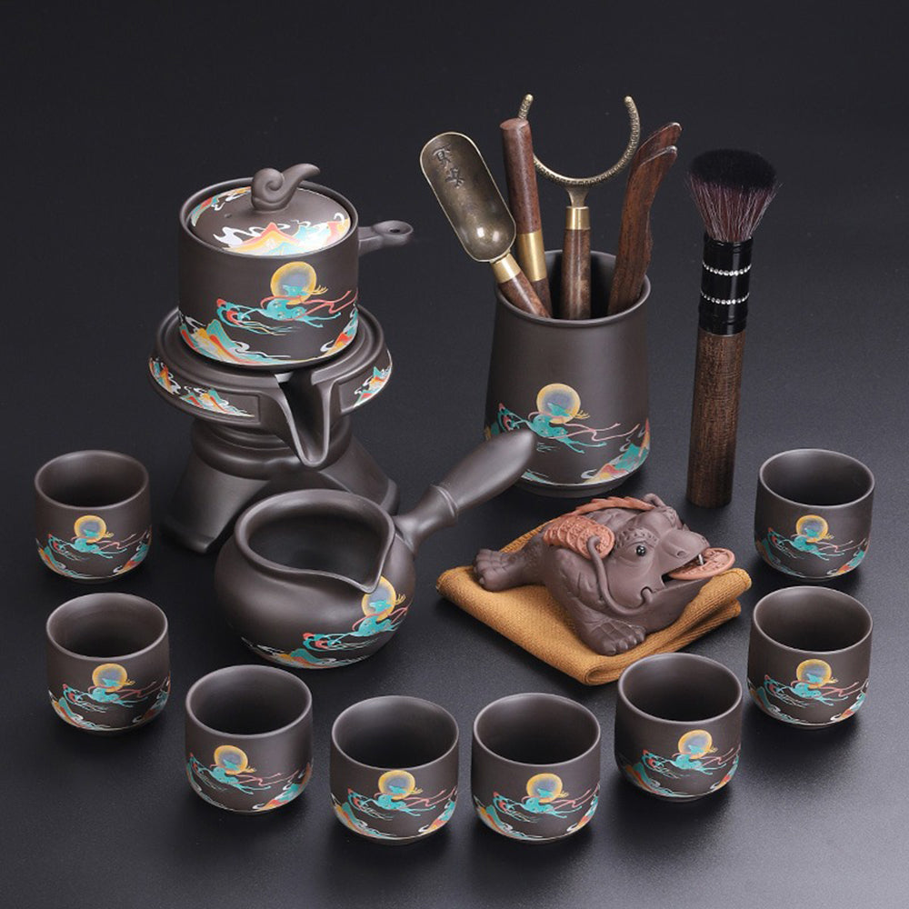 Elegant purple clay tea set with deers design, showcasing intricate craftsmanship.