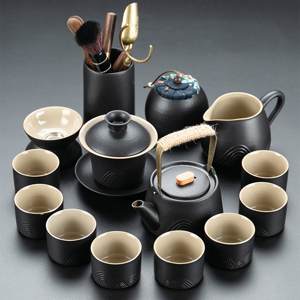 Close-up of Japanese black pottery teapot with mountain design