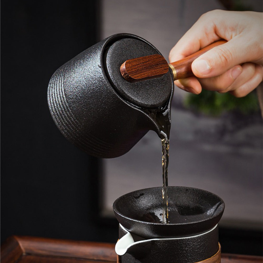 Set of six tea cups and strainer on a wooden tray for traditional tea ceremony