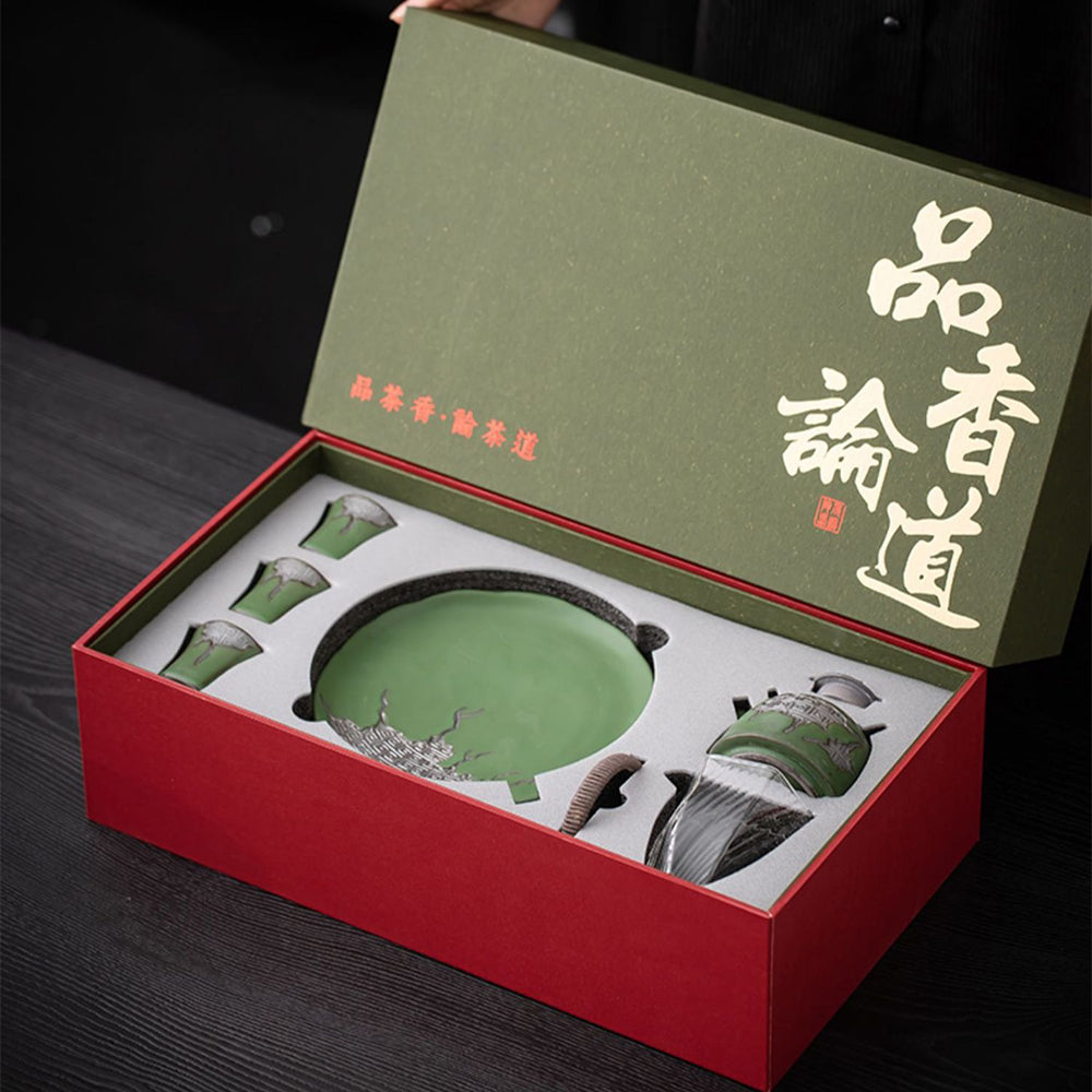 Close-up of the teapot spout demonstrating smooth pouring functionality and built-in filter.
