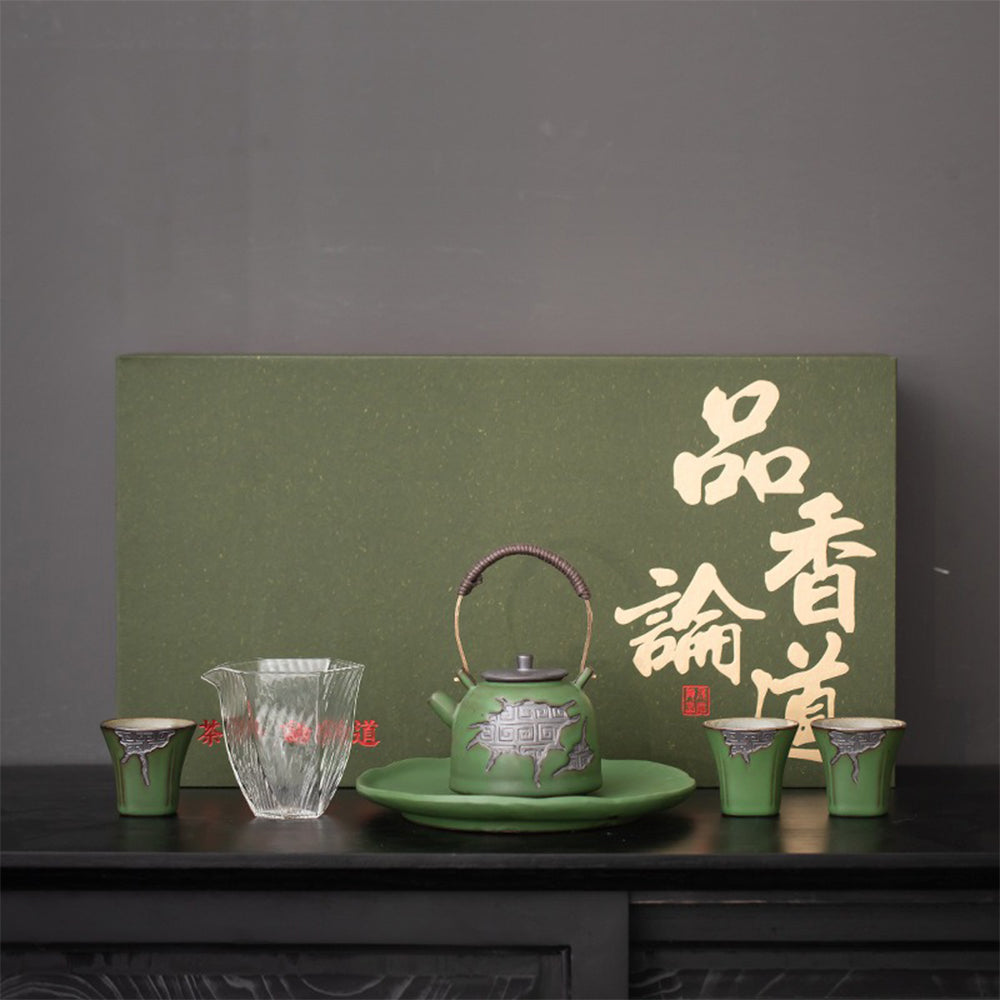 A beautifully crafted Japanese pottery tea set showcasing vibrant colors and auspicious cloud patterns.