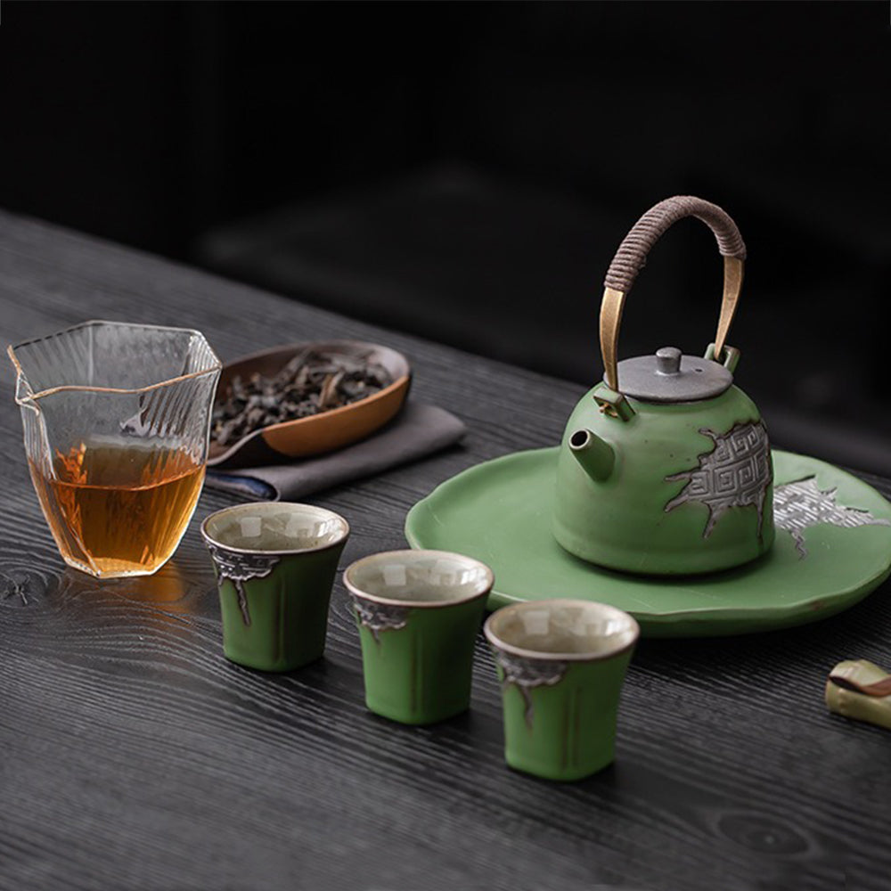 Close-up of the teapot spout demonstrating smooth pouring functionality and built-in filter.