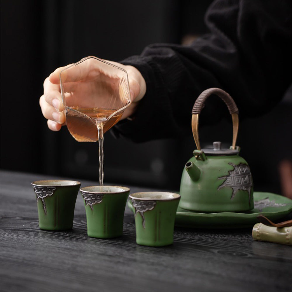The complete tea set arranged on a rustic table, highlighting the elegant design and artisanal craftsmanship.
