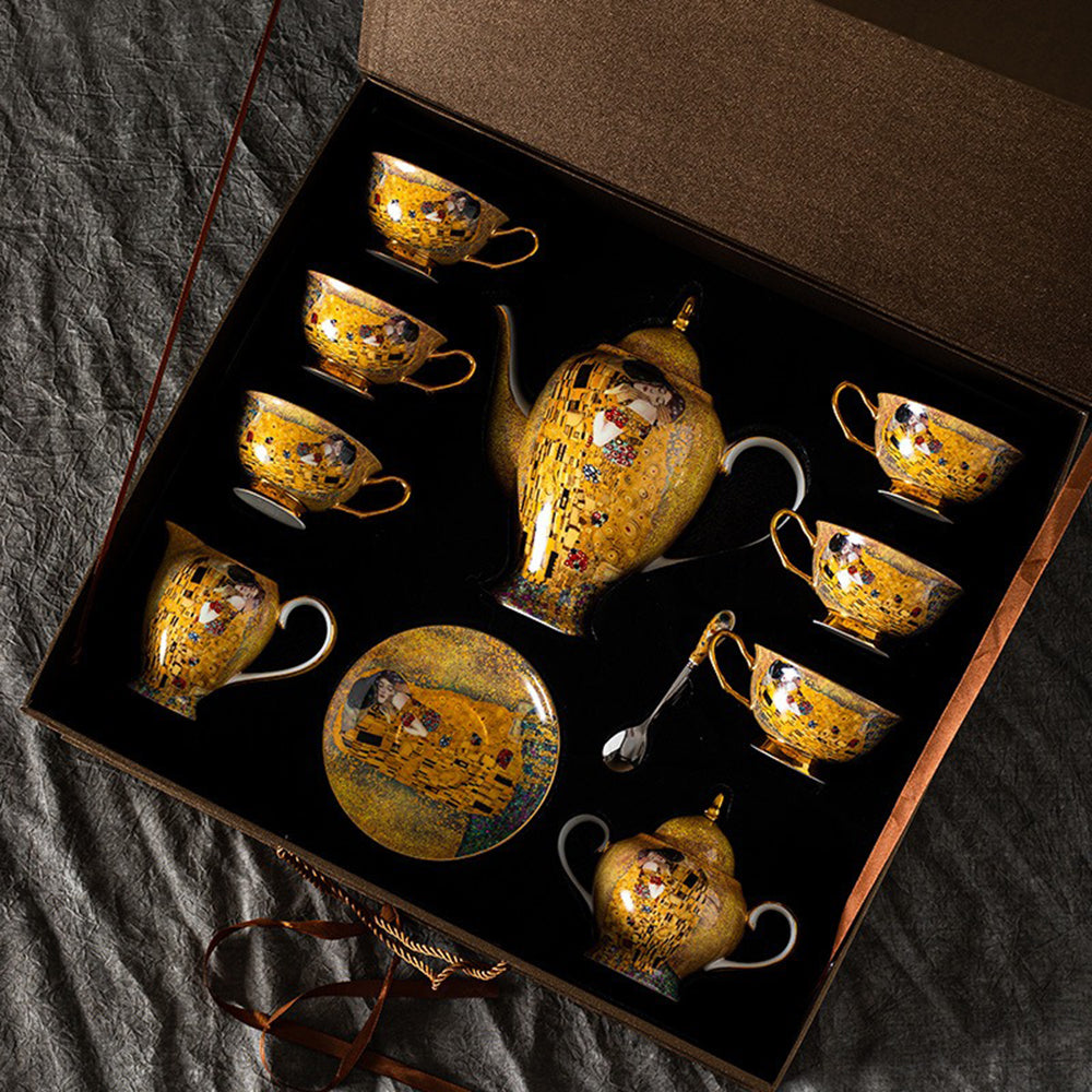 Set of six cups and saucers with gilded handles, perfect for hosting a refined tea gathering.