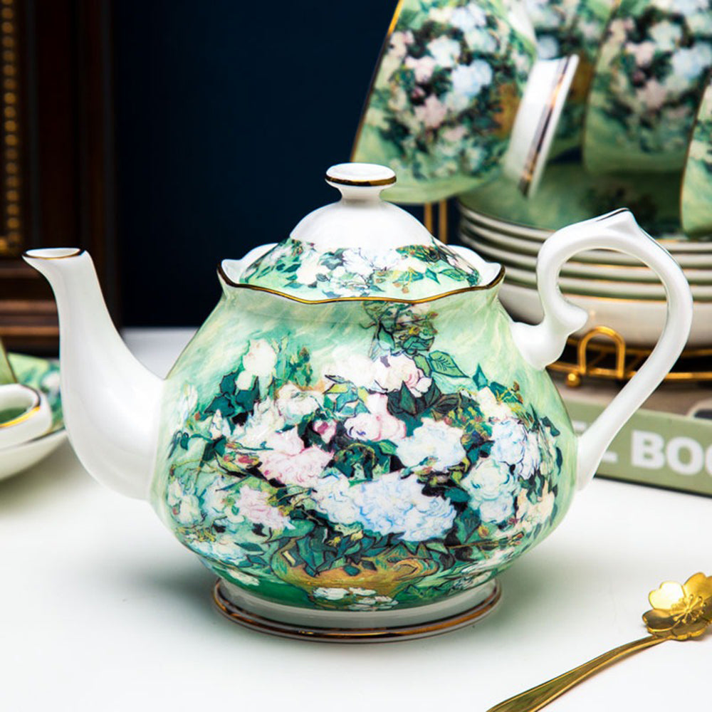 Close-up of cup and teapot detailing from the luxury tea set with gold trim.