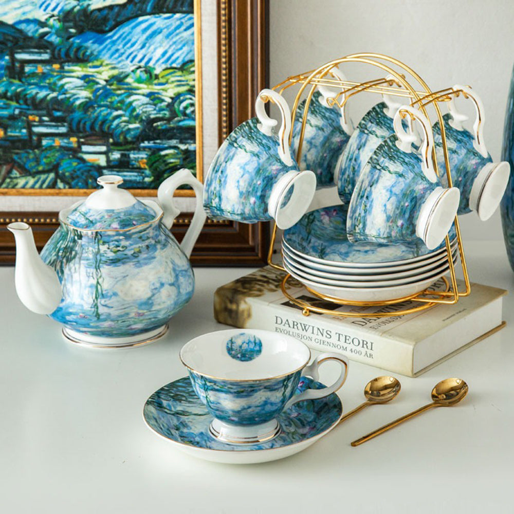 Top-down view of the artistic tea set arranged on a wooden table, showcasing Monet’s Water Lilies design and golden accents.