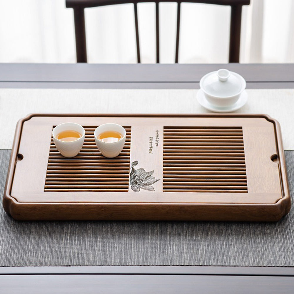 Side view of the large bamboo tea tray, highlighting its smooth texture and elevated edges.