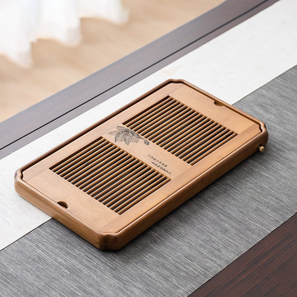 Close-up of the drainage feature of the tea serving tray, emphasizing its practical design.