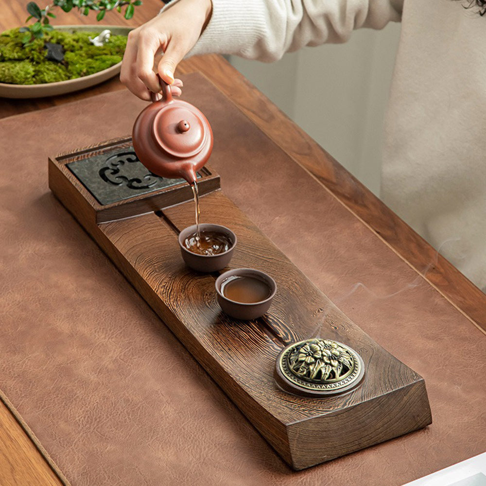 Elegant PANGA-PANGA wood tea tray showcasing incense burner and removable stone panel from a side angle.