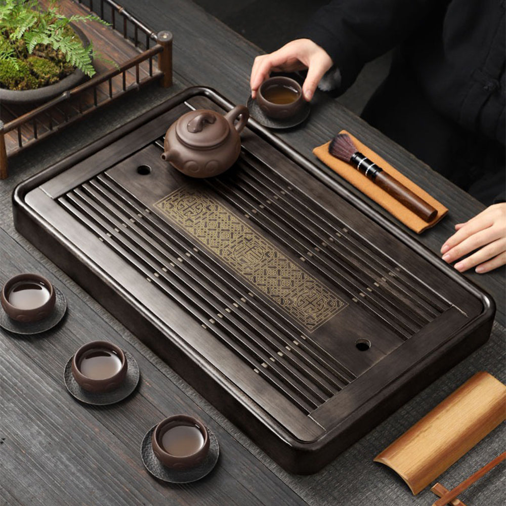 Close-up of the high-quality tea tray with drainage hole and smooth finish.