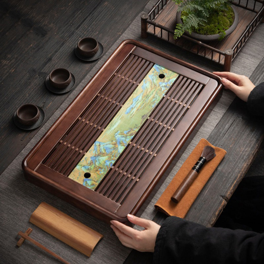 Close-up of the Chinese landscape pattern on the wooden tea tray