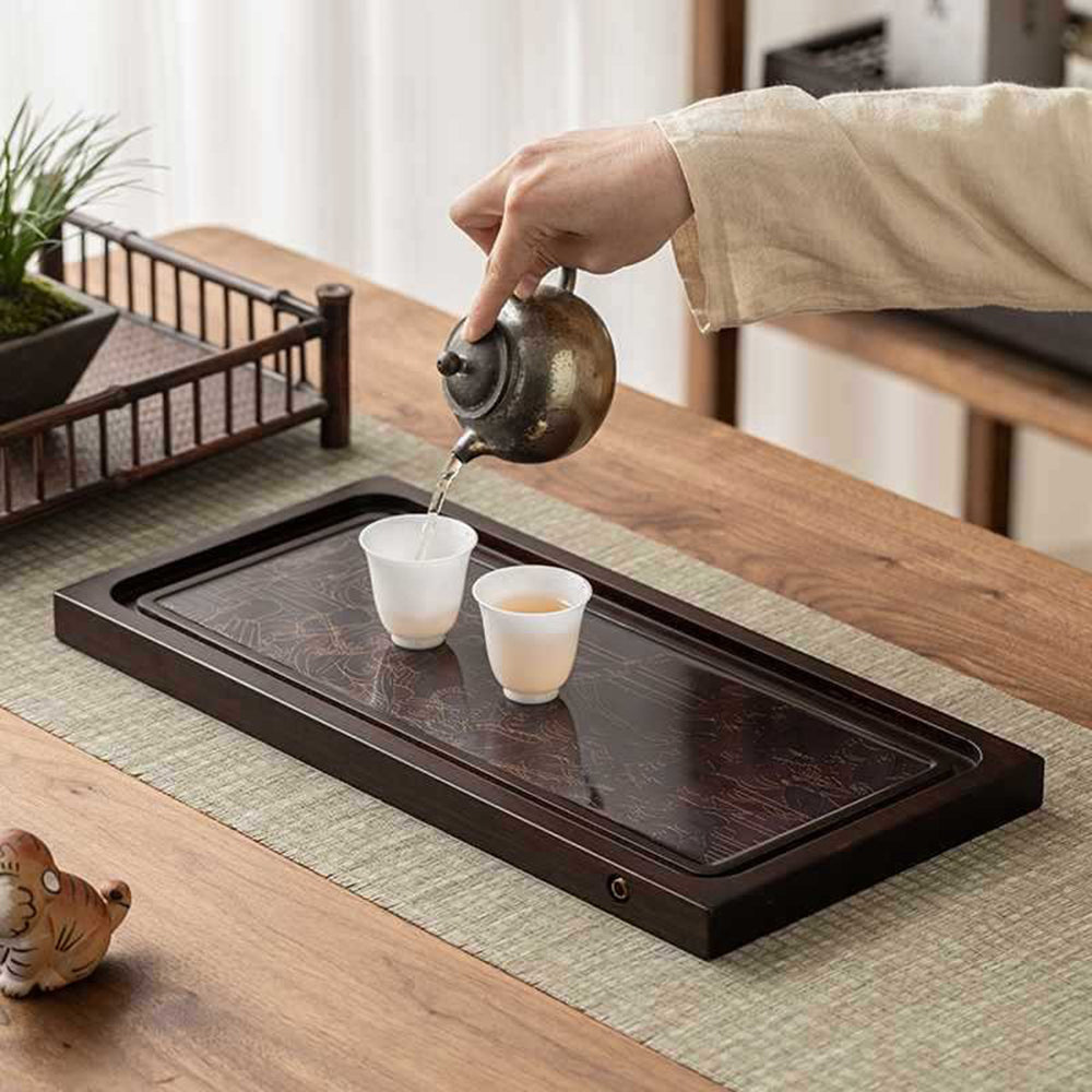 Side view of the bamboo tea tray with drainage features