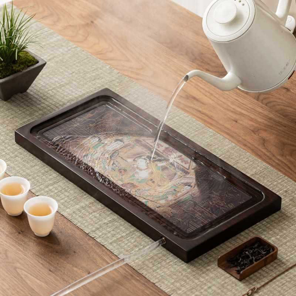 Color change bamboo tea tray showcasing intricate patterns under hot water