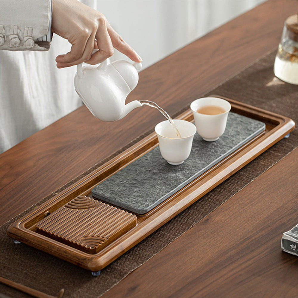 Close-up of the bamboo tea tray, highlighting its durable materials and intricate design.