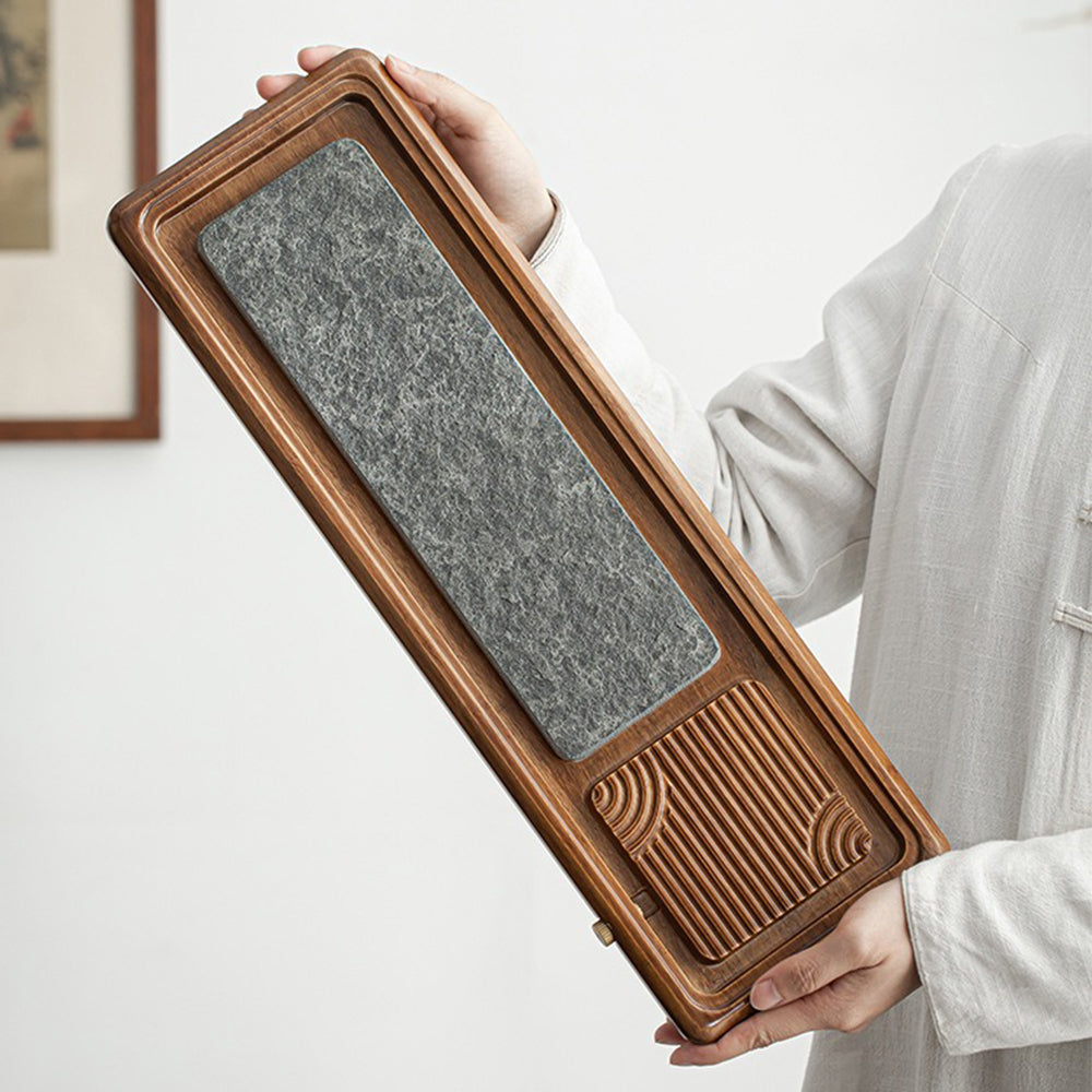 Close-up of the bamboo tea tray, highlighting its durable materials and intricate design.