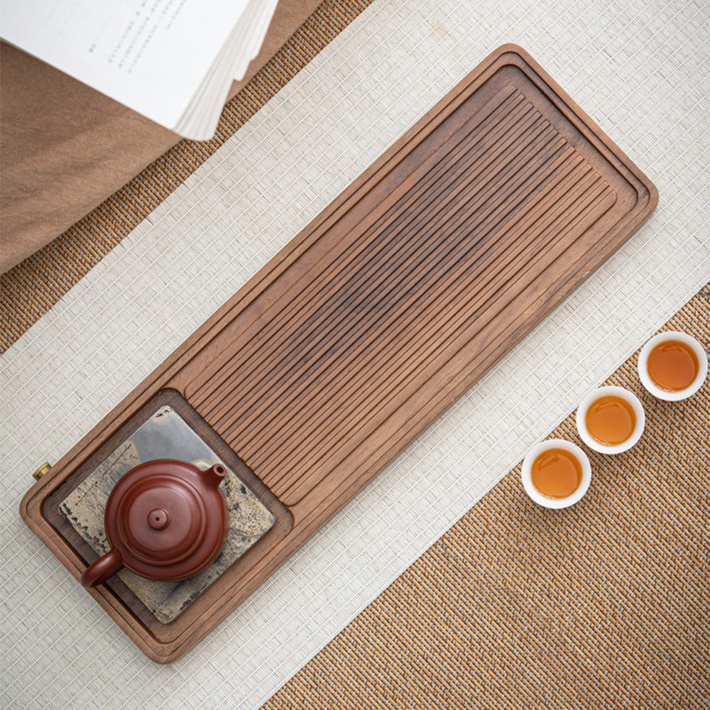 Close-up of the artistic stone painting on the walnut tea tray
