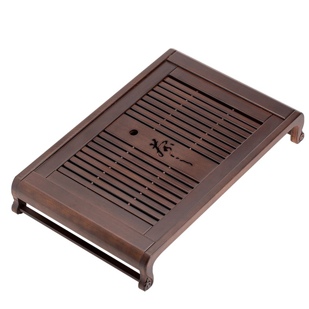 Close-up of ebony wood gongfu tea tray with drainage system