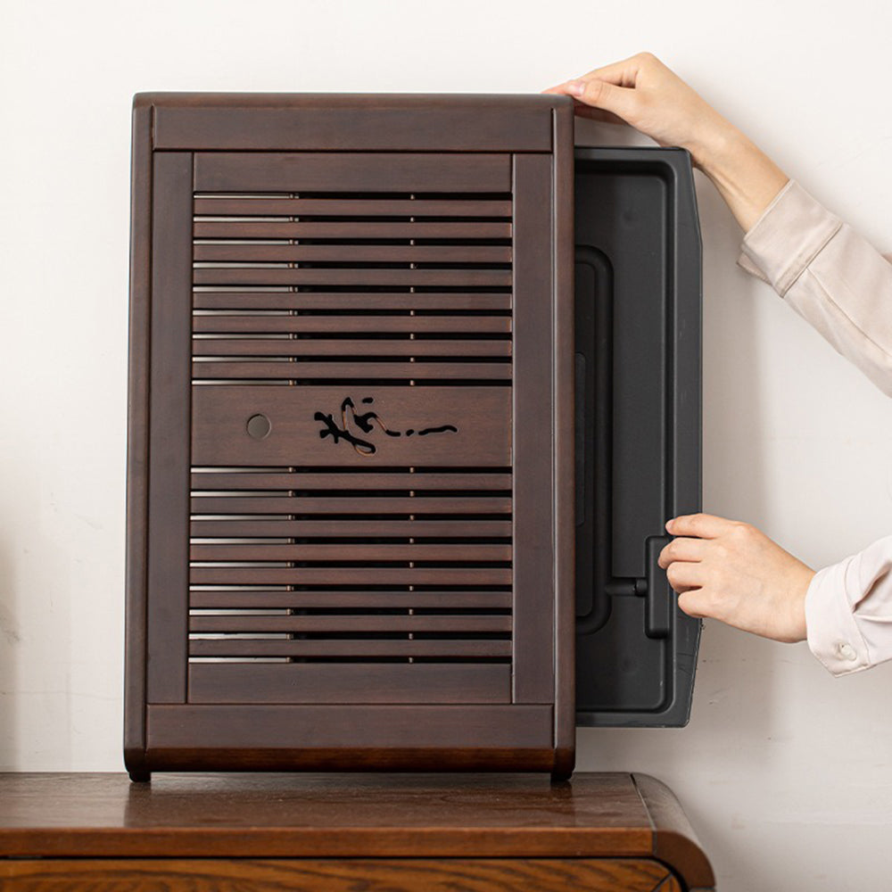 Close-up of ebony wood gongfu tea tray with drainage system