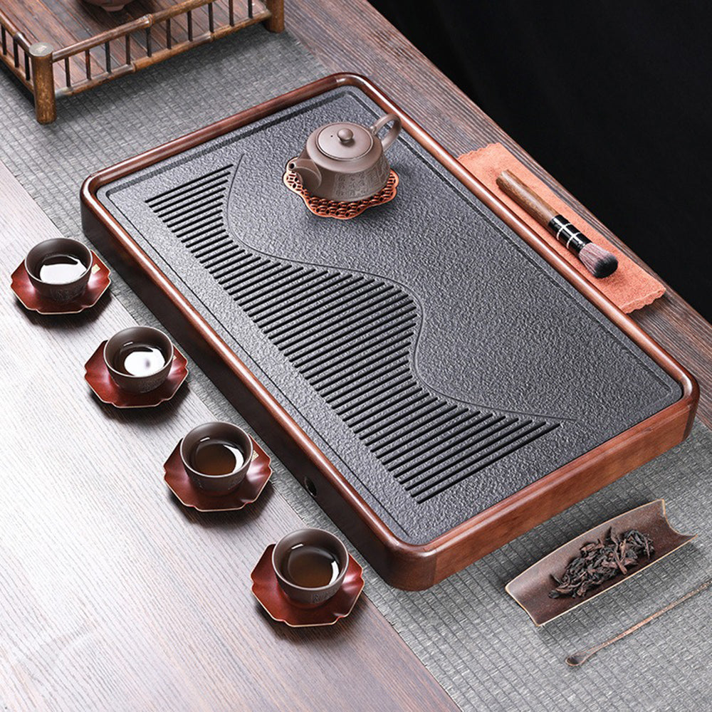 Side view of the black stone tea tray displaying its elegant design and functionality.