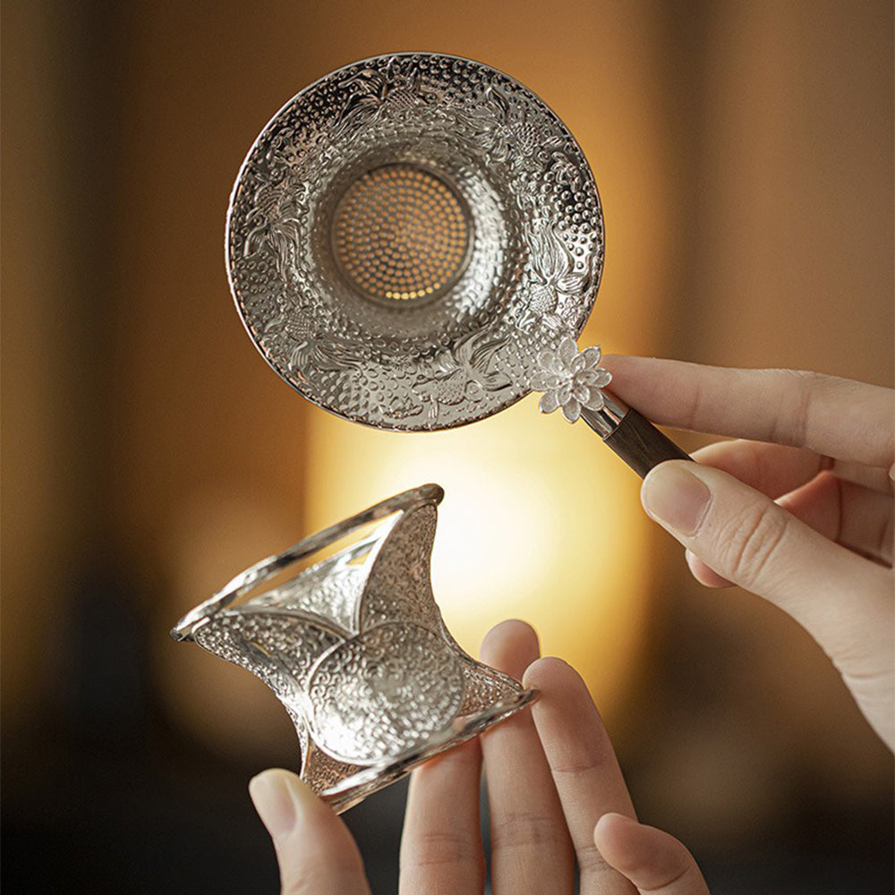Elegant Lotus Goldfish Alloy Tea Strainer on a wooden table