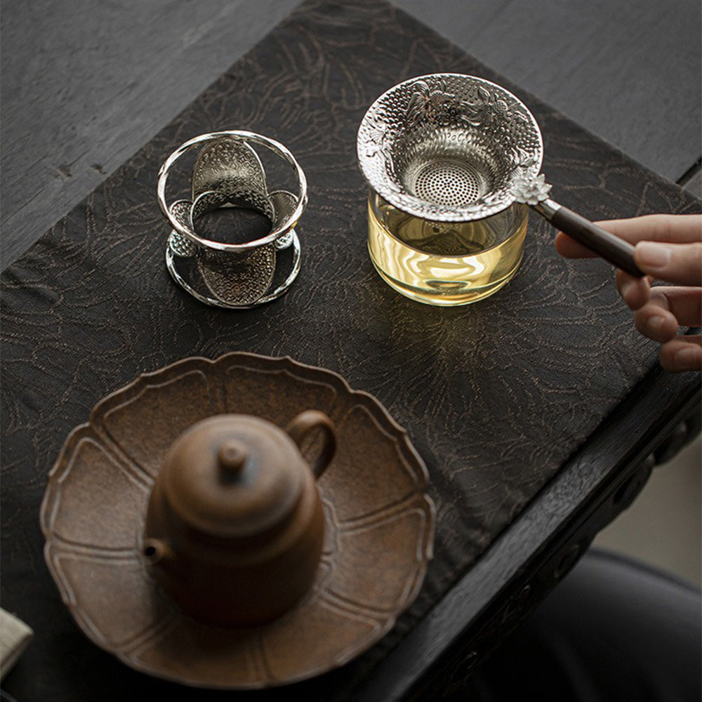 Lotus Goldfish Tea Strainer in use with a cup of brewed tea