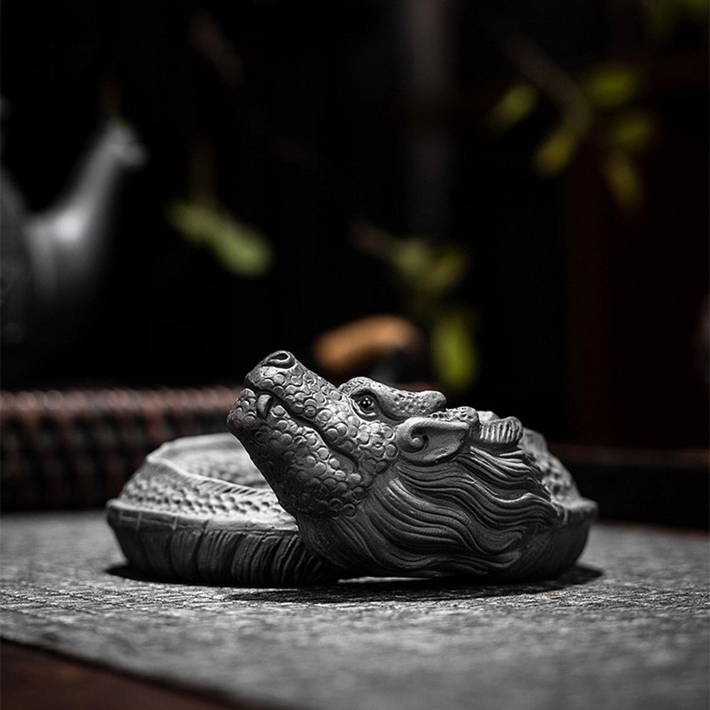 Close-up of the dragon purple clay tea strainer showcasing intricate details and craftsmanship.