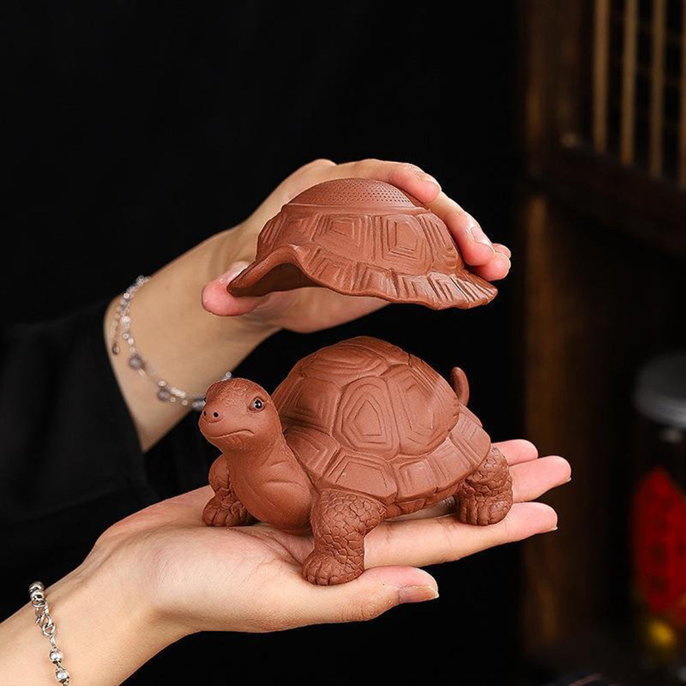 Close-up of the turtle tea strainer highlighting the detailed craftsmanship.