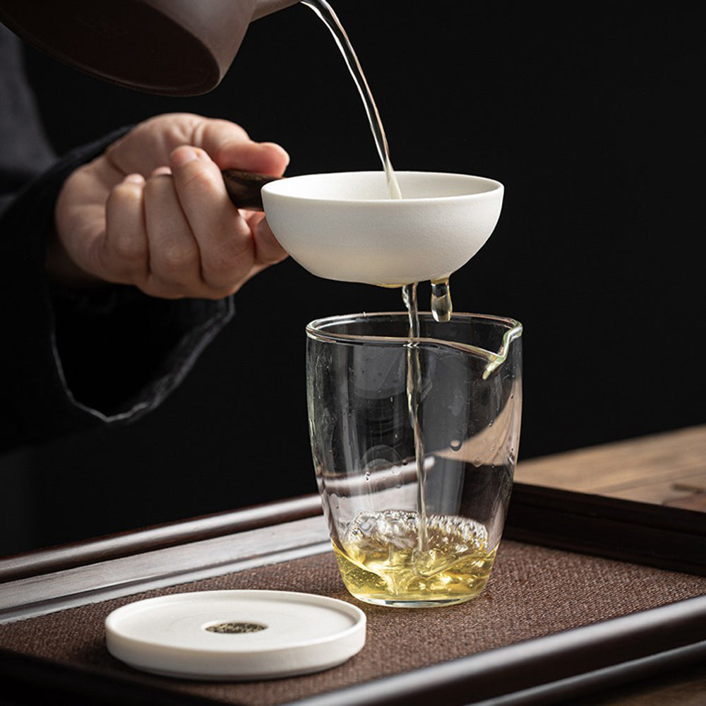 Close-up of the ceramic tea strainers frosted surface and filter holes, ideal for loose leaf tea.