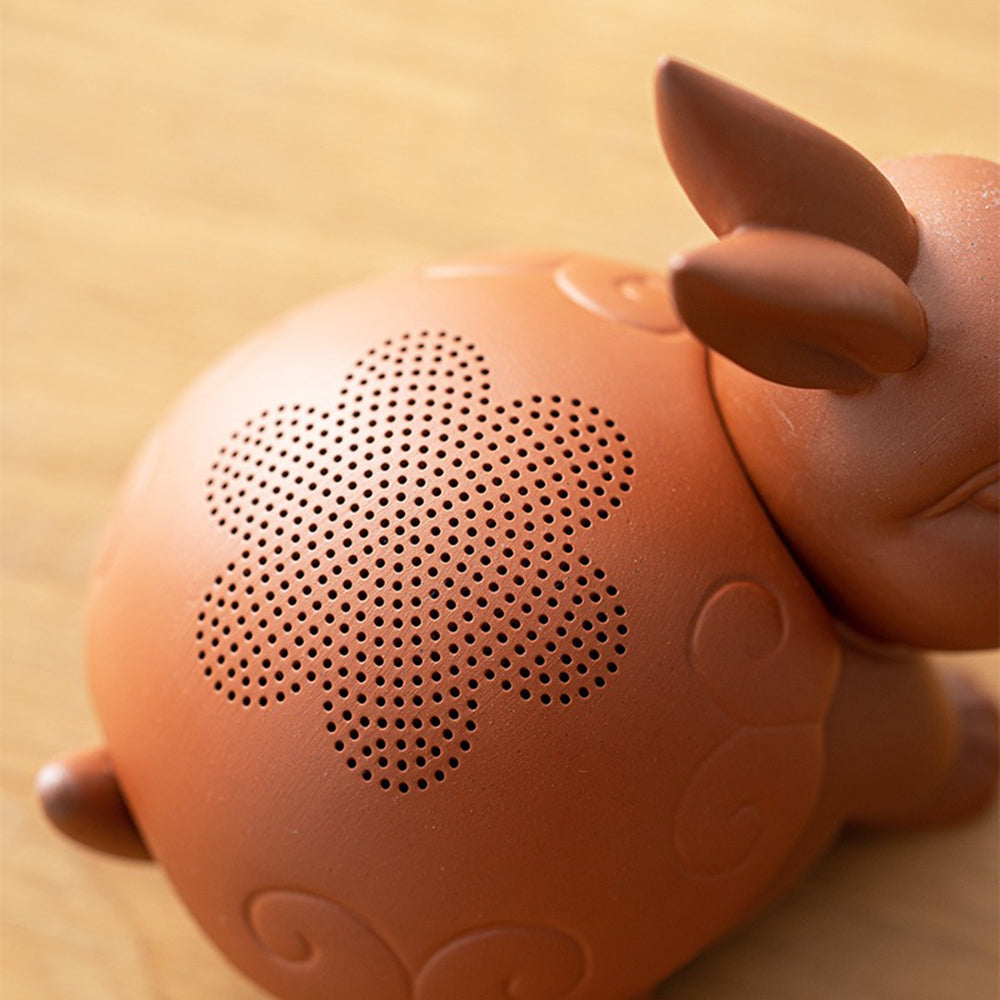 Handcrafted purple clay rabbit tea pet strainer with bright eyes and detailed features