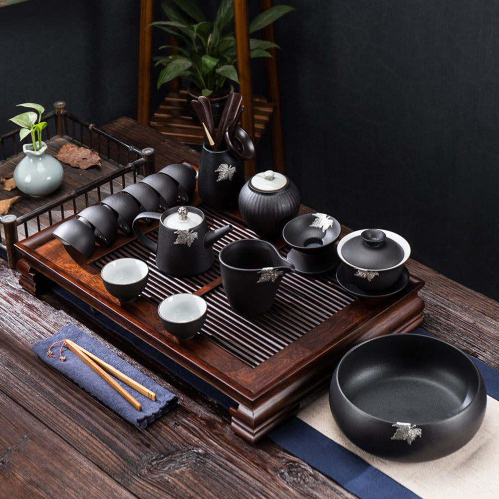 Tea set arranged on a wooden table for elegant tea ceremony presentation